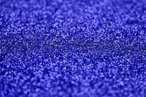 Blue decorative sequins. Background image with shiny bokeh lights from small elements photo