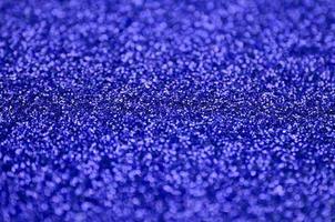 Blue decorative sequins. Background image with shiny bokeh lights from small elements photo