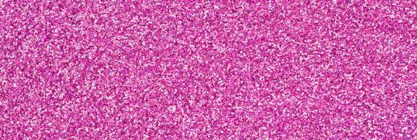Pink decorative sequins. Background image with shiny bokeh lights from small elements photo