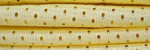 Yellow mesh sport wear fabric textile background pattern photo