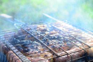 Poor and improper cooking meat on fire. Toasted meat with overcooked crust photo