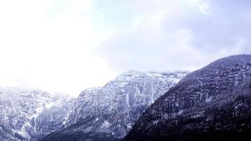 Hallstatt dreamscape winter snow mountain landscape outdoor adventure with blue sky in snowy day, Austria photo