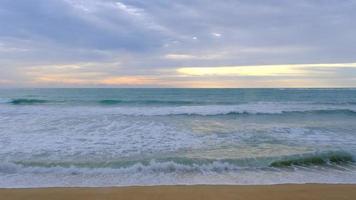 Beautiful sea waves and white sand beach in the tropical island. Soft waves of blue ocean on sandy beach background from top view from drones. video