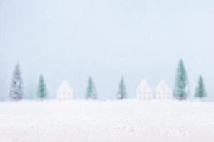 Blurred natural Landscape tree and home of snow background for Merry Christmas and Happy New Year photo