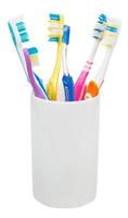 five tooth brushes and interdental brush photo