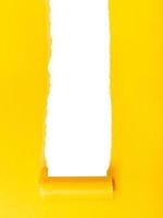 vertical yellow rolled-up torn paper on white photo