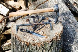 hew axe and ironmongery on wooden block photo