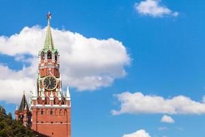 Spasskaya Tower of Moscow Kremlin and blue sky photo