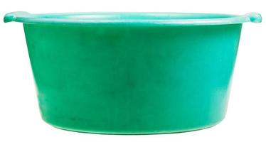 side view of old green plastic round wash basin photo