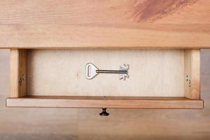 one safe key in open drawer photo