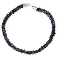 round necklace from string of black beads isolated photo