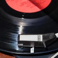 above view of headshell on disc in record player photo