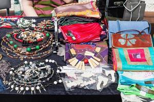 table with accessories, jewelry, bags, scarves photo