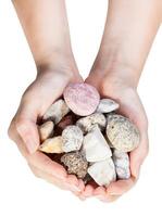 top view of various natural pebbles in handful photo