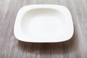 white bowl on gray brown board photo