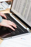 businessman working with laptop at office desk photo