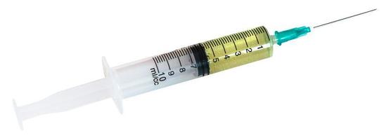 little 10 ml syringe filled with yellow liquid photo