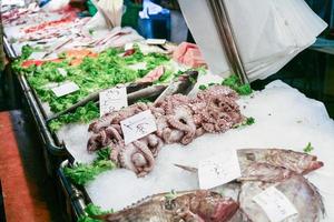 sea foods on ice in market in Venice city photo