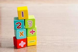 Number wood block cubes for learning Mathematic, education math concept. photo