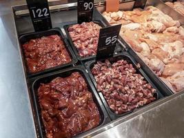 Sorted Chicken Internal Organs for Sale at the Butcher's in a Supermarket. photo