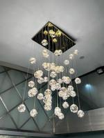 Close-up of a beautiful crystal chandelier Beautiful chandelier. luxury expensive chandelier hanging under ceiling photo