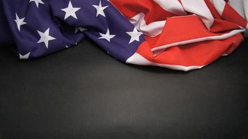 Rumpled Flag of United States of America on grey background photo