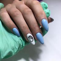 blue female manicure on nails close up photo