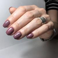 Purple manicure on the nails. Purple nail design on the fingers. photo