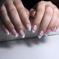 French manicure on the nails. French manicure design. Manicure gel nail polish photo