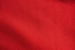 Red sports clothing fabric football jersey texture close up photo