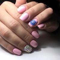 professional pink female manicure on nails close up photo