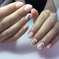 Woman with flesh-colored manicure with design, close up photo
