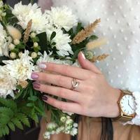 Woman with flesh-colored manicure with design, close up photo