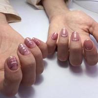 Female hands with stylish pink manicure on white background photo
