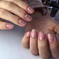 Female hands with stylish pink manicure on white background photo