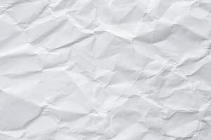 Abstract white crumpled paper texture background photo