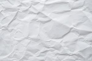 Abstract white crumpled paper texture background photo