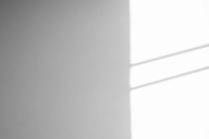Window shadow drop on white wall background photo