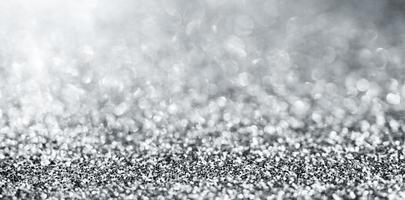 Abstract silver glitter sparkle texture with bokeh background photo