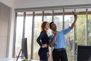 Businessman and businesswoman with happy smile successful deal. Business people selfies together. photo