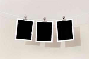 Three Blank Vintage instant photo frame hanging on a rope. Template