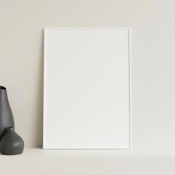 Minimalist front view vertical white photo or poster frame mockup leaning against wall on table with vase. 3d rendering.