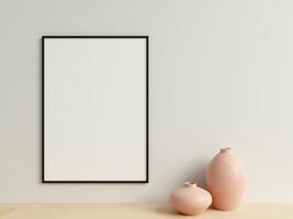 Clean and minimalist front view vertical black photo or poster frame mockup hanging on the wall with vase. 3d rendering.