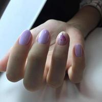 Stylish trendy female pink manicure.Hands of a woman with pink manicure on nails photo