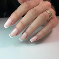 French manicure on the nails. French manicure design. Manicure gel nail polish photo