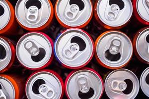 Empty aluminium drink cans recycling background concept, top view closeup photo