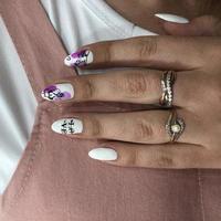 Woman's hands with white nails and love design photo