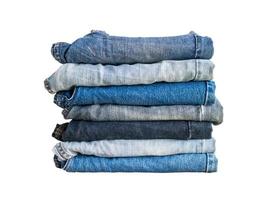 denim blue jeans stack isolated on white background photo