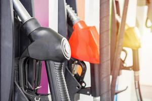 Petrol filling nozzles at gas station pump photo