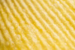 Potato chip texture background closeup photo